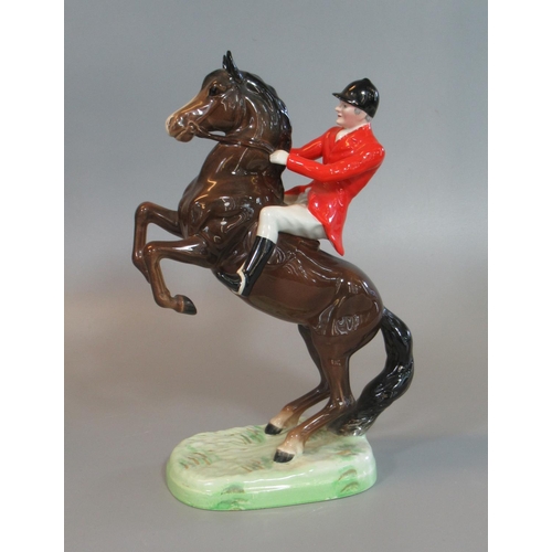 69 - Beswick 868 Huntsman seated on a rearing horse with red jacket and black cap, together with another ... 