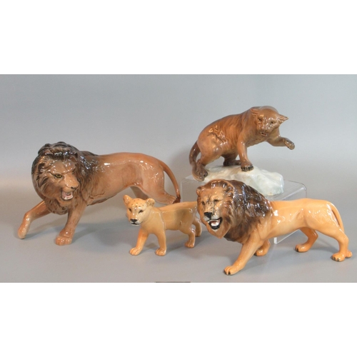 71 - Collection of Beswick wild African animals to include two similar male roaring lions, lion cub, and ... 