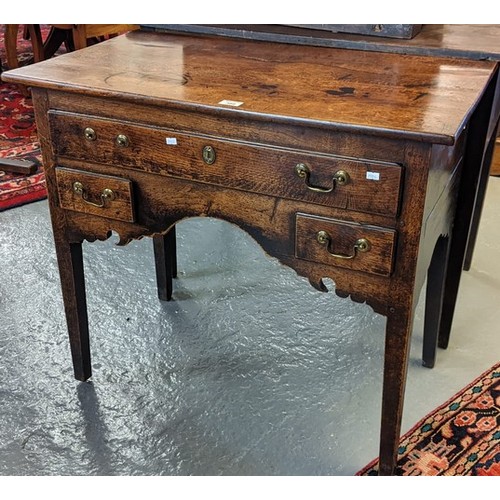 389 - Early 19th century oak lowboy, the moulded top above and arrangement of one long and two short drawe... 