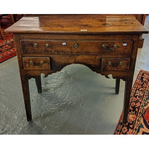 389 - Early 19th century oak lowboy, the moulded top above and arrangement of one long and two short drawe... 