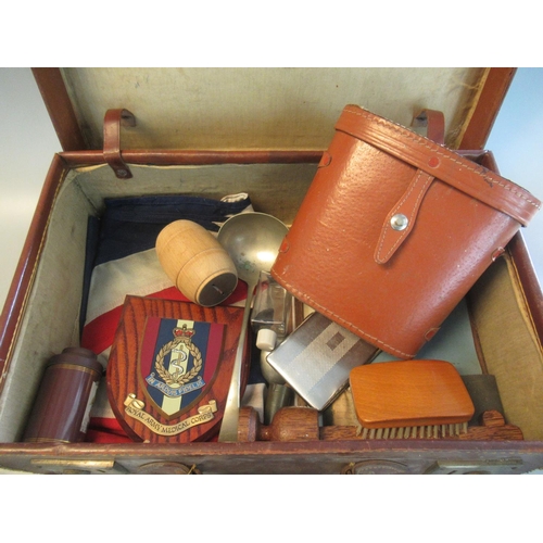 105 - Leather suitcase containing assorted items including army medical corps shield, plaque, binoculars, ... 