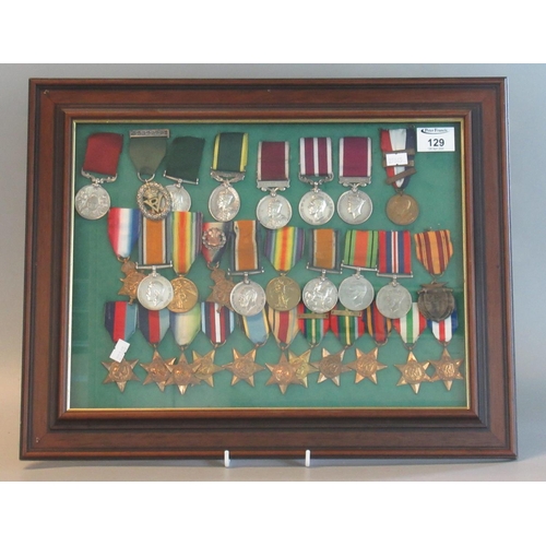 129 - A Framed Collection of Assorted British WWI and WWII Medals to include various Stars, War Medals, Vi...