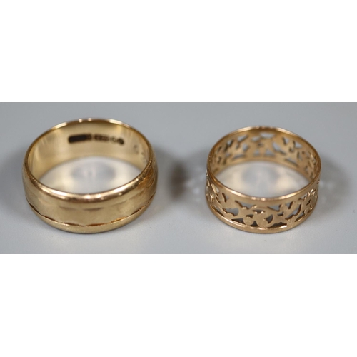 275 - A 9ct gold ring and a 14ct pierced gold ring.  Ring size K and G.  Approx weight in total 5.4 grams.... 