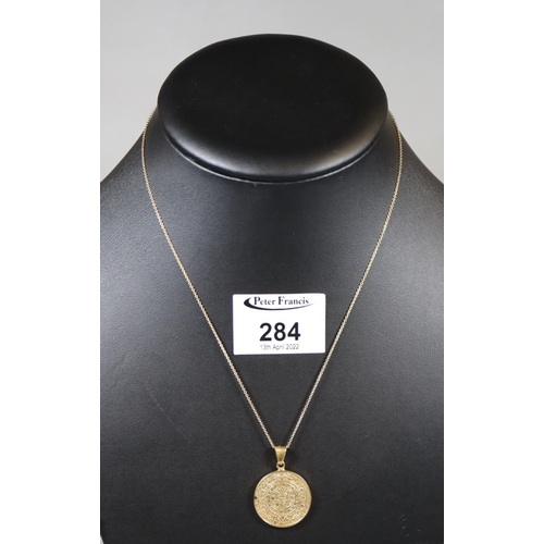 284 - A gemset medallion, 'Acapulco' on 14ct gold chain.
(B.P. 21% + VAT)