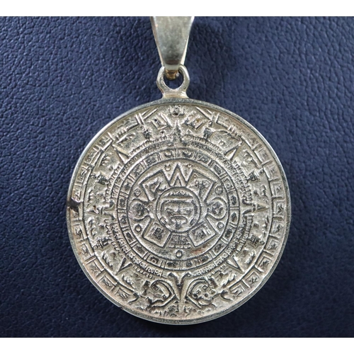 284 - A gemset medallion, 'Acapulco' on 14ct gold chain.
(B.P. 21% + VAT)