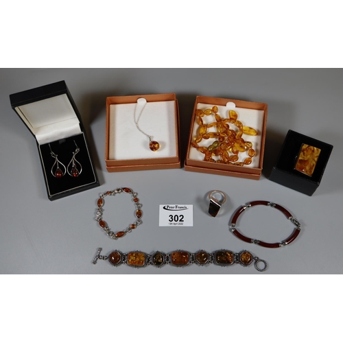 302 - A collection of silver and amber jewellery.
(B.P. 21% + VAT)