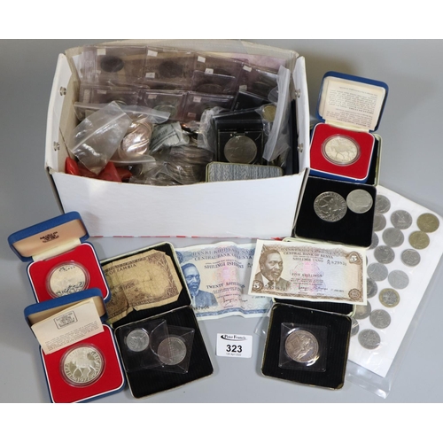 323 - Box of assorted foreign and British coins and bank notes including a large collection of QEII crowns... 