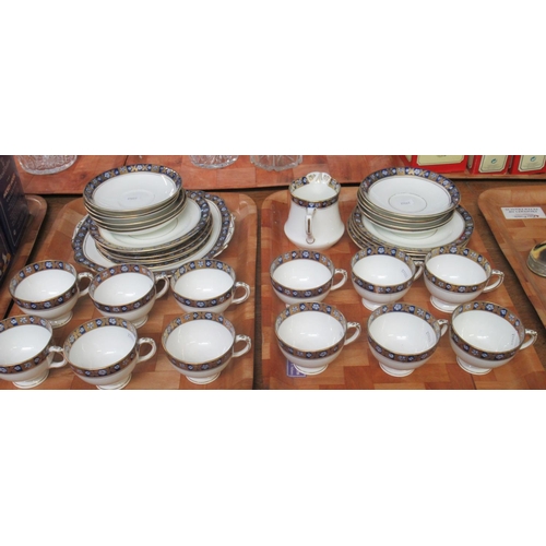 353 - Two trays of Diamond china tea ware decorated with a gilt and navy blue floral band on a white groun... 