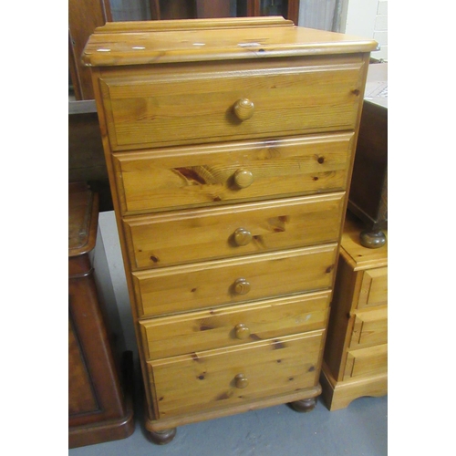 489 - Modern pine bedroom straight front chest of six drawers with turned handles on baluster turned feet.... 