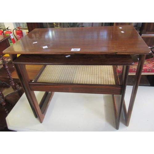 492 - Nest of two rosewood Danish Silkeborg tables, the smallest with rattan lower shelf. (2)
(B.P. 21% + ... 