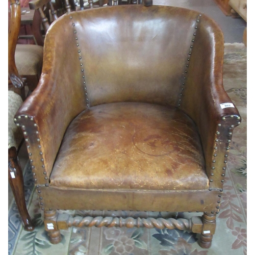 502 - Early 20th century tan leather tub type chair with barley twist supports.
(B.P. 21% + VAT)