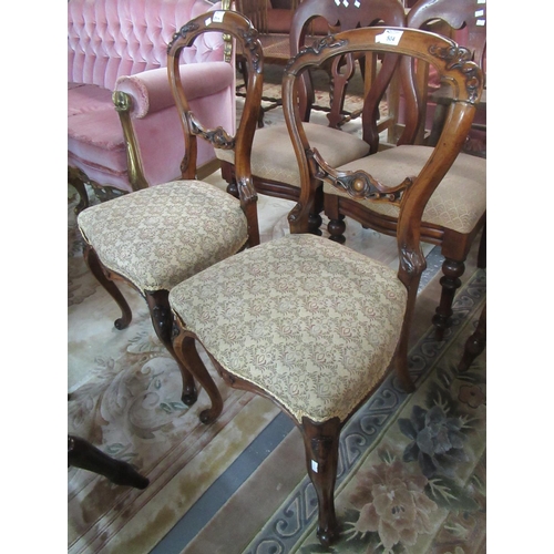 504 - Pair of Victorian walnut carved balloon-back chairs on cabriole legs. (2)
(B.P. 21% + VAT)