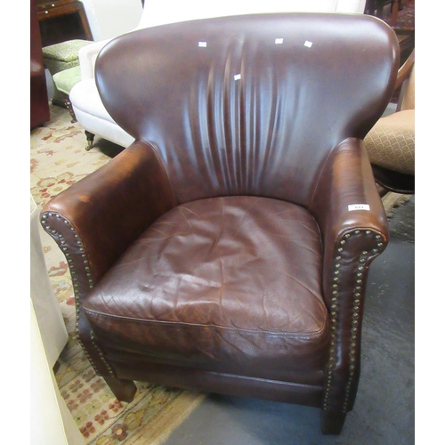 511 - Modern brown leather armchair.
(B.P. 21% + VAT)