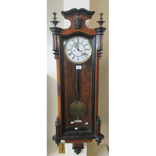 521 - Early 20th century walnut ebonised two-train Vienna type wall clock with pendulum and key, and mask ... 