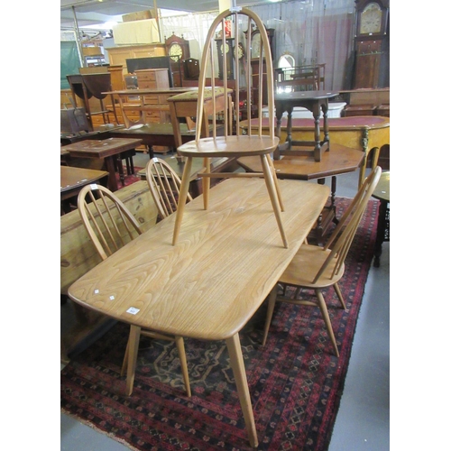 522 - Ercol Light elm and beech dining set to include table and a set of four spindle and hoop back chairs... 