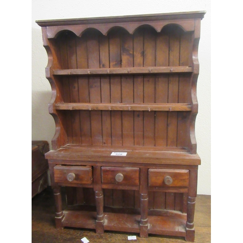 528 - Modern pine miniature rack-back pot board dresser.
(B.P. 21% + VAT)