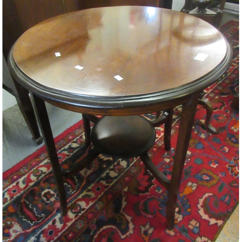 532 - Edwardian mahogany inlaid lamp table of circular form with under tier.
(B.P. 21% + VAT)