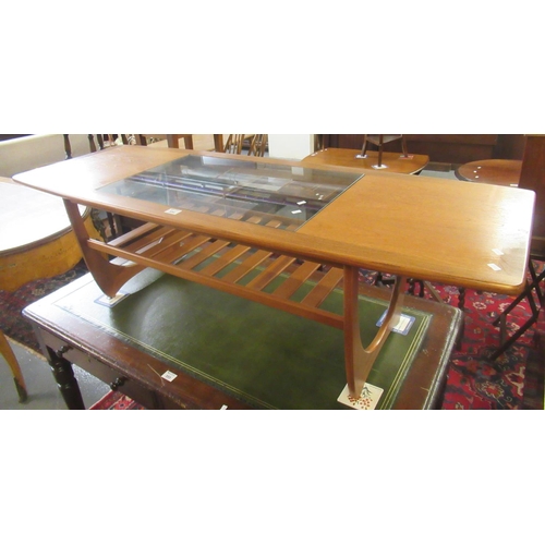 554 - 1960's/70's teak G-plan coffee table with glass inset top and pierced under tier.
(B.P. 21% + VAT)