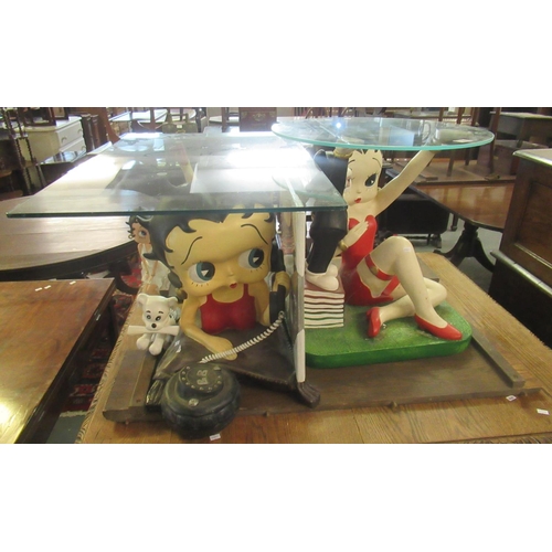 563 - Collection of Betty Boop items to include two glass top lamp tables, Betty Boop figurine, and framed... 