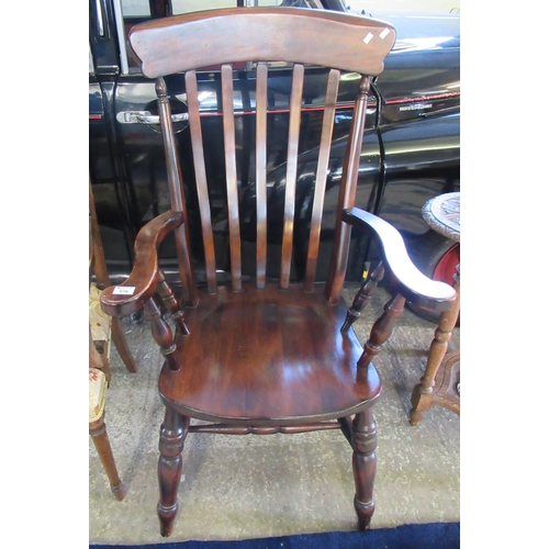 576 - 19th Century design stained slat backed kitchen fireside armchair with baluster turned legs.  
(B.P.... 