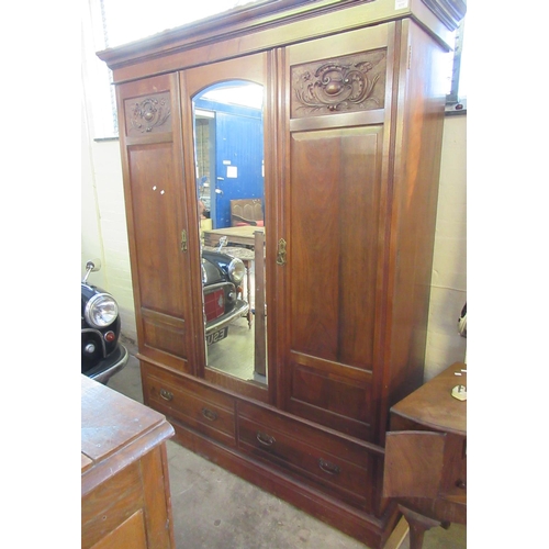 579 - Edwardian mahogany mirror centre two door wardrobe with carved panels and two under drawers.  1.48M ... 