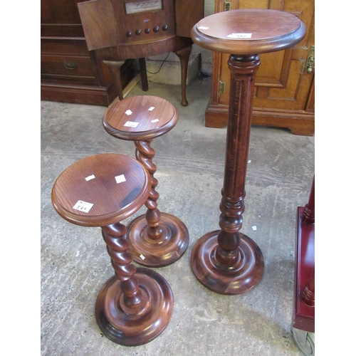 582 - Pair of reproduction stained oak barley twist torchere stands and another with fluted column. (3)
(B... 