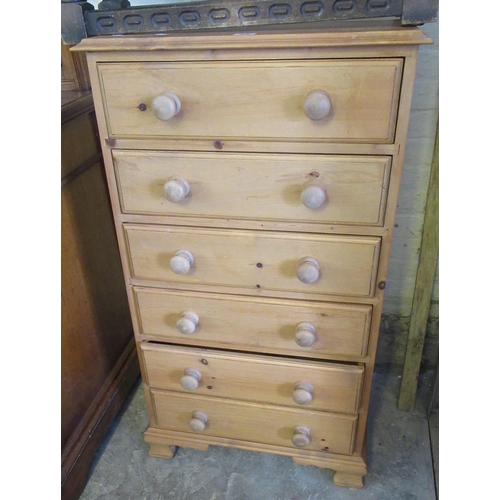 588 - Modern tall pine chest of six drawers having turned knobs. 64cm wide approx.
(B.P. 21% + VAT)