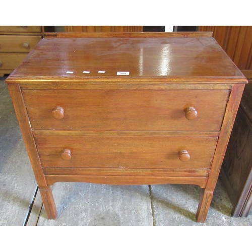 589 - Useful small oak bedroom chest of two drawers. 75cm wide approx.
(B.P. 21% + VAT)