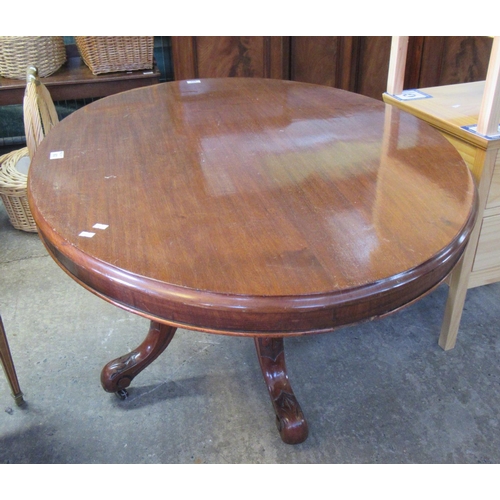 603 - Victorian mahogany oval centre table on carved quadreform base.
(B. P. 21%+VAT)