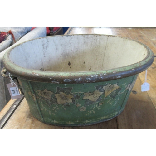 605 - Painted oval shaped two-handled jardinière/planter decorated with trailing vines (probably French).
... 