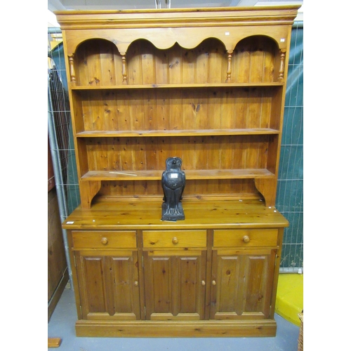 607 - Modern natural pine rack-backed dresser with three drawers and three cupboards to the base.
(B.P. 21... 