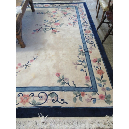 621 - Chinese cream ground floral decorated wash rug with banded border and central foliate decoration. 36... 