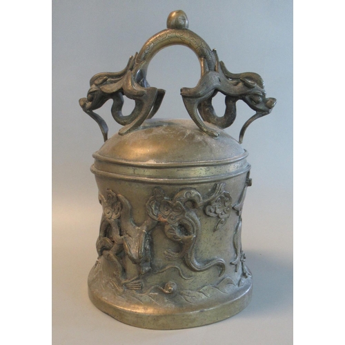 82 - Yellow metal Oriental temple style bell, decorated with a dragon and Buddhist symbols, with two styl... 