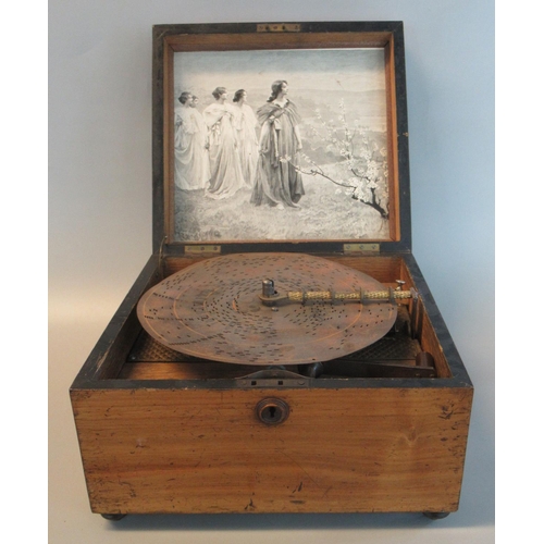 85 - 19th century Polyphon disc player, the case with inlaid cartouche, the clockwork mechanism playing o... 