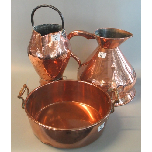 92 - Large 19th century copper conical jug, together with another copper jug with iron handle, and a copp... 