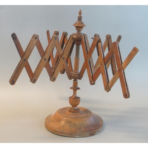 95 - 19th century extending walnut line or wool winder on turned circular base.
(B.P. 21% + VAT)