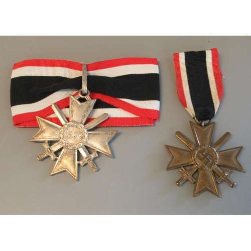 104 - German WWII merit cross (second class), together with a Knight Cross of the war merit cross (copy). ... 