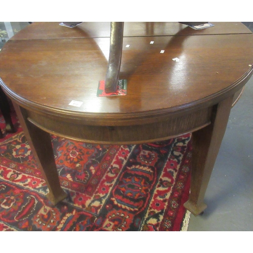 510 - Edwardian oak extending dining table with winder standing on tapering legs and castors.  (B.P. 21% +... 