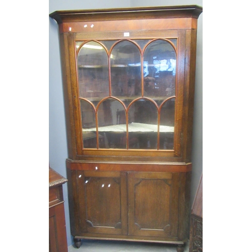 521 - Early 19th centruy Welsh oak two stage corner cupboard with glazed single door top having three fitt... 