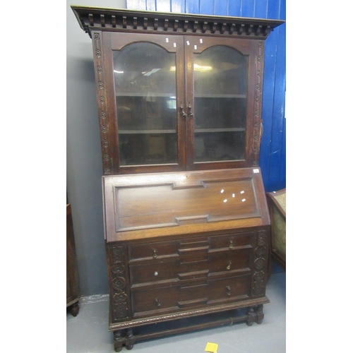 522 - Early 20th century oak bureau bookcase having two door glazed top over fall front and three moulded ... 