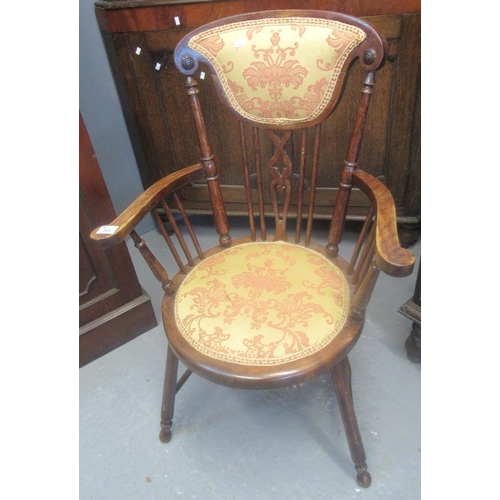 523 - Early 20th century stained beech elbow chair with padded back and circular padded seat.
(B.P. 21% + ... 