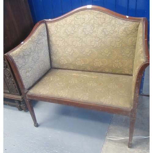 527 - Edwardian mahogany show frame arched back two seater sofa, with padded upholstery on square tapering... 