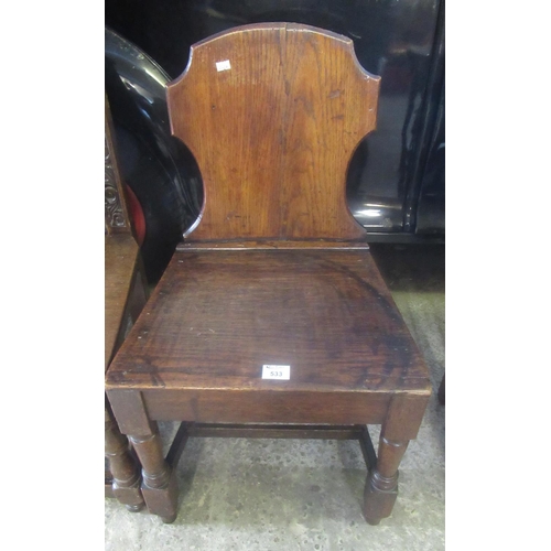 533 - Oak hall chair in 17th century style with shaped back and solid seat.
(B.P. 21% + VAT)