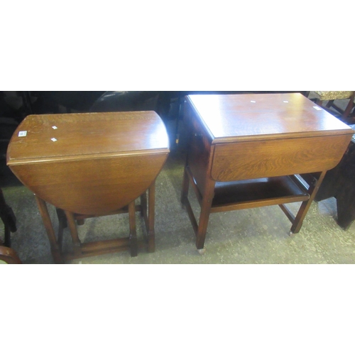 535 - Mid 20th century oval oak drop leaf, gate leg tea table, together with an oak drop leaf tea trolly o... 