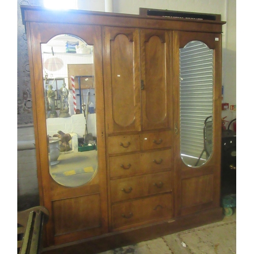 542 - Edwardian three section mirror door compactum type wardrobe with cupboard and drawers to the centre.... 