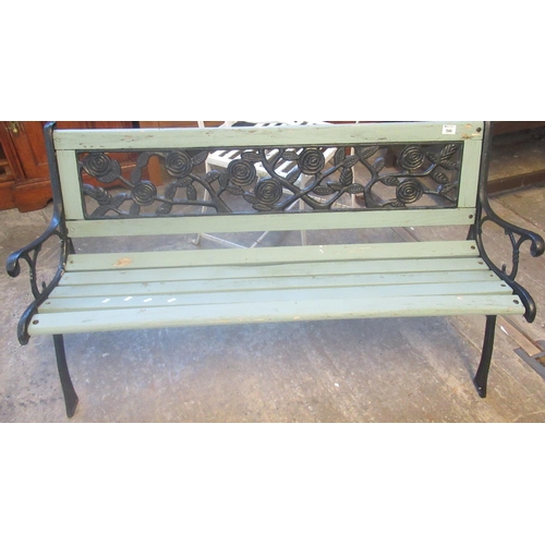 546 - Modern metal and wooden two seater floral decorated garden seat.  (B.P. 21% + VAT