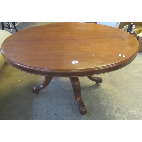 549 - Victorian mahogany oval centre table on carved quadreform base.
(B. P. 21%+VAT)