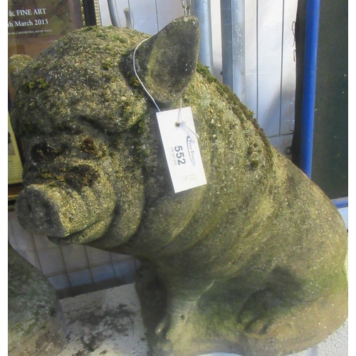 552 - Weathered composition garden figure of a seated pig.(B.P. 21% + VAT