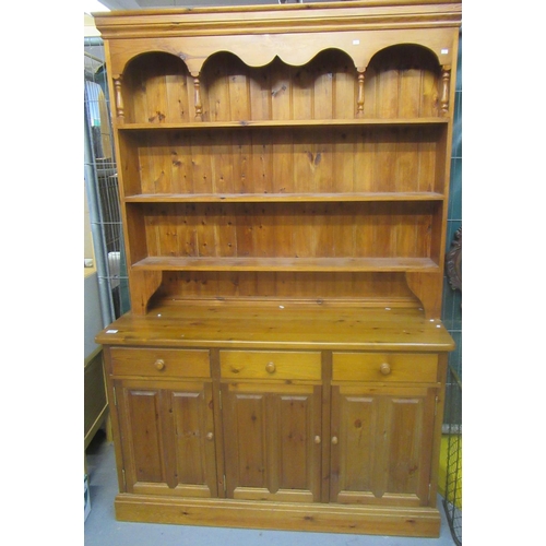 559 - Modern natural pine rack-backed dresser with three drawers and three cupboards to the base.
(B.P. 21... 