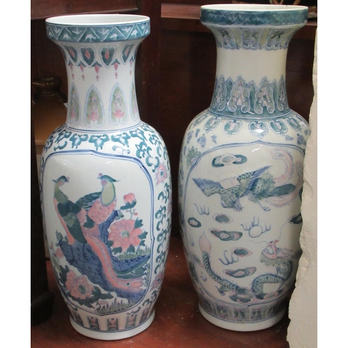 74 - Two similar Chinese design baluster shaped floor vases decorated with reserved panels of birds (mode... 